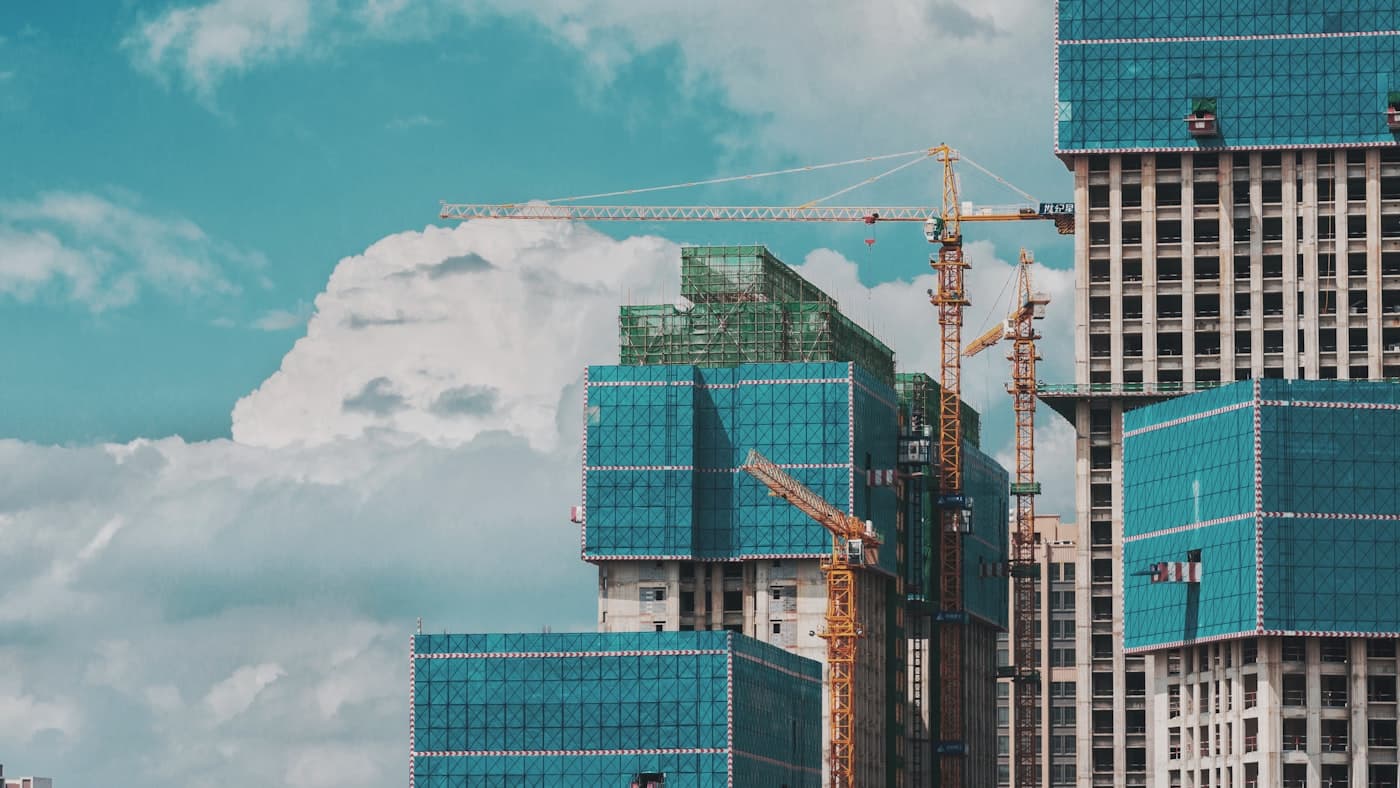 BuildMax engineers reviewing plans at a construction site